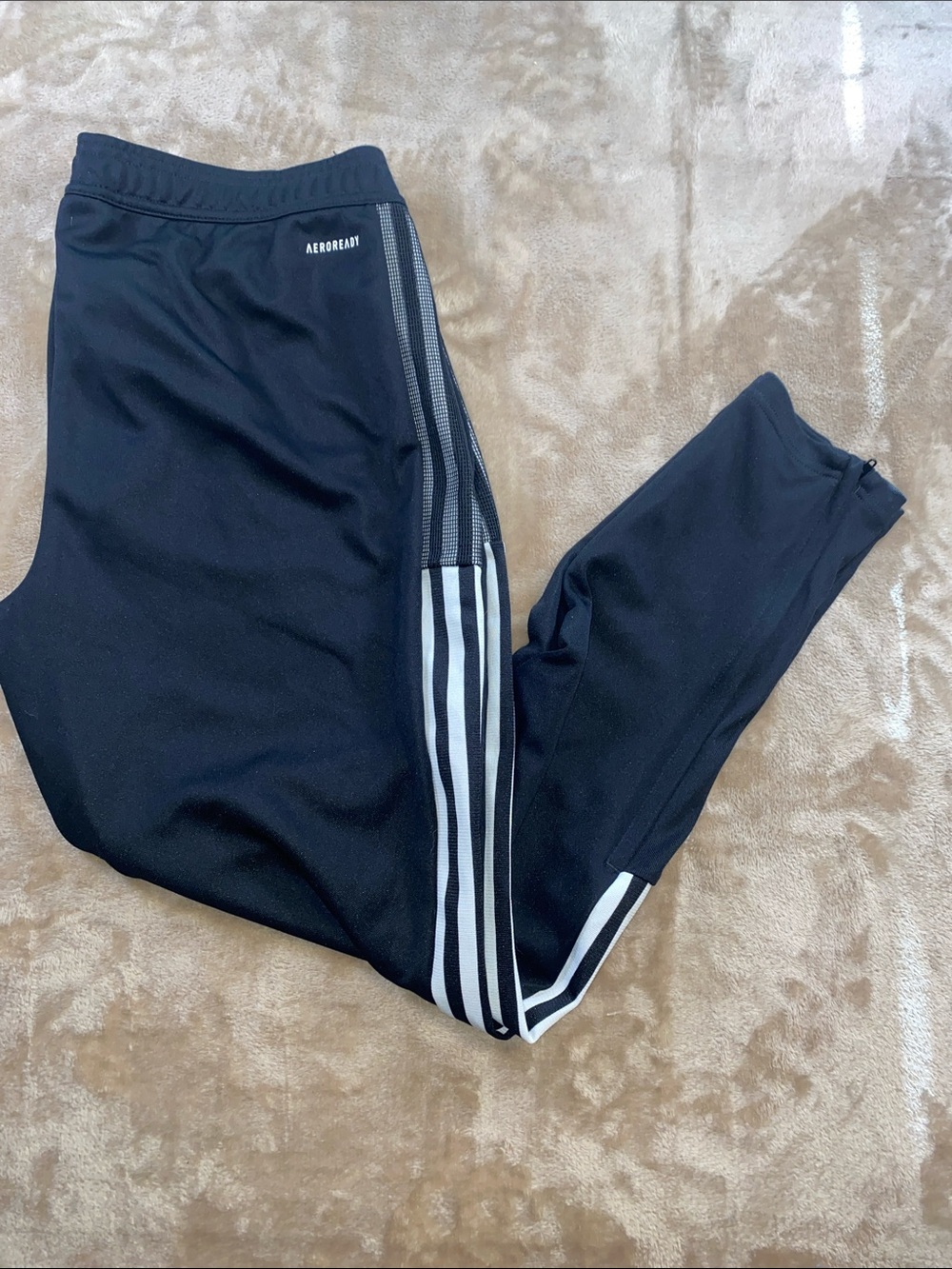 adidas Black Joggers with White Triple Stripes pockets and zips by ankle